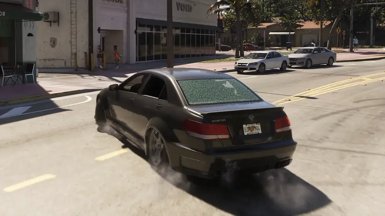A dark sedan turns across a city street with smoke around its tires in GTA VI.