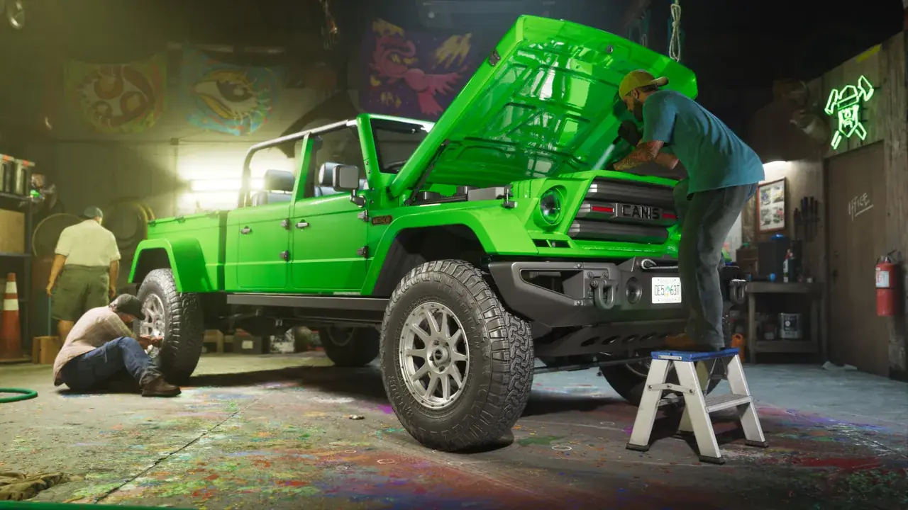 Mechanics work around a bright green pickup with its hood raised in a GTA VI workshop.