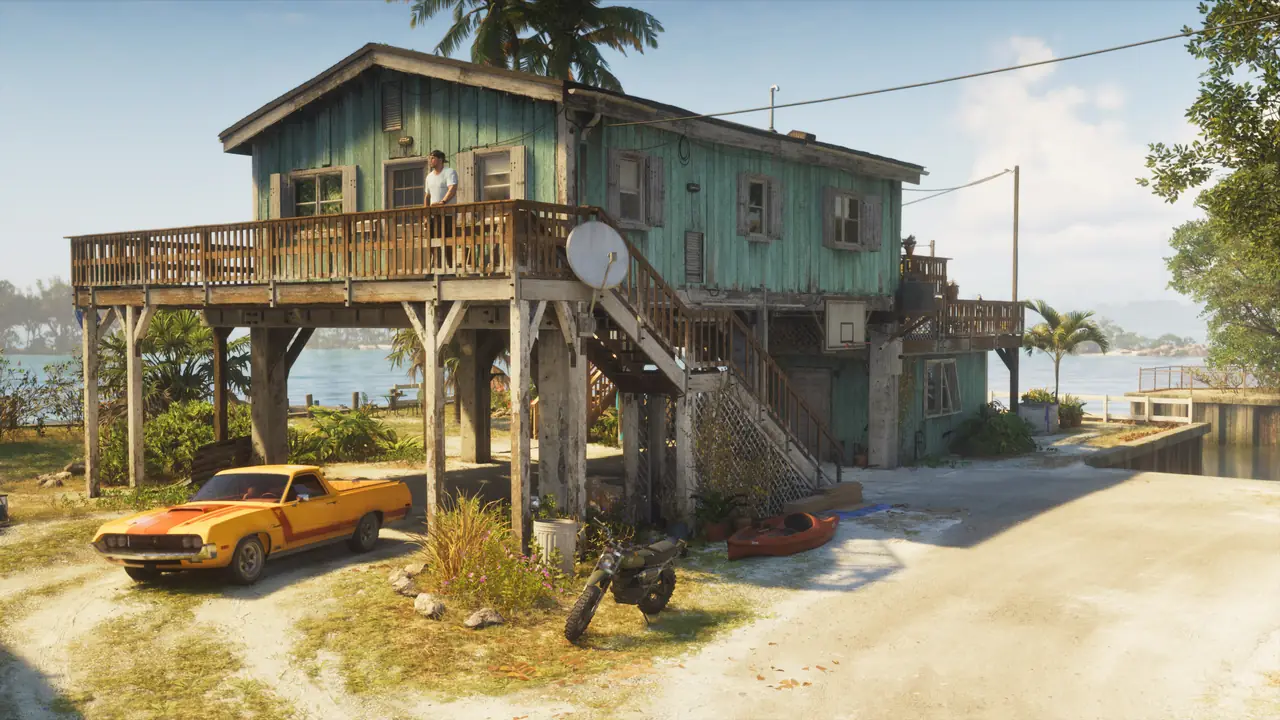 Jason’s stilt house on the water with a yellow Ganado pickup parked in front in GTA VI.