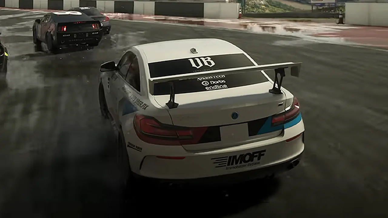 White Übermacht Cypher race car with a rear wing on a wet track, rear view